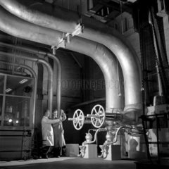 Workers with great steam pipes  ICI Wilton  1955.