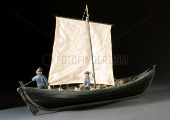 Norse whale boat with three figures  1931.