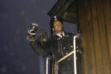 Guard showing right away light  Bishopsgate  London  July 1962.