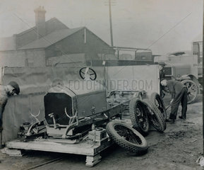 Napier car engine and chassis preparing for shipping at the docks