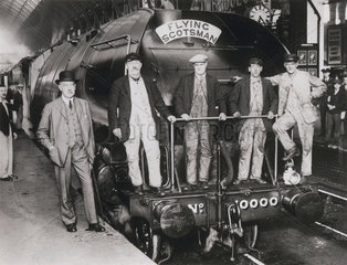 Sir Nigel Gresley with railwaymen beside locomotive No 10 000  1930.
