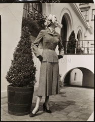 Fashion study: woman in a tweed suit  1960s.