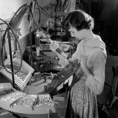 A female worker welds a Gestetner duplicating machine  Tottenham  1957.