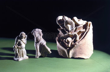 Roman votive viscera and two pregnant figures.