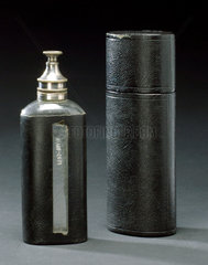 Thomas’s chloroform drop bottle in leather case  1885-1925.