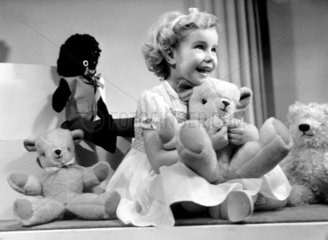 Little girl with a teddy bear  1949.