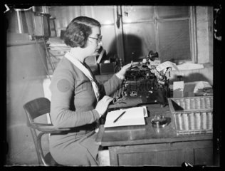Typist in an office  4 February 1934.