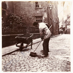 Street sweeper  c 1905.