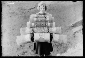 Woman carrying Christmas crackers  1932.