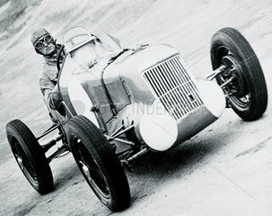 Sir Malcolm Campbell racing at Brooklands  Weybridge  Surrey  1935.