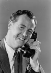 Smiling man on the telephone  1952.