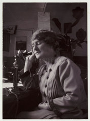 Woman talking on the telephone  1926.