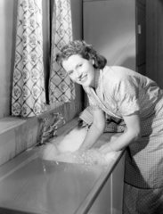 Woman doing the washing up  1948.