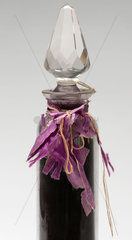 Bottle containing mauveine salts  c 1863-1864.