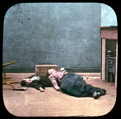 Drunken woman and boy unconscious on floor  c 1895.