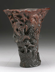 Rhinoceros horn cup with carved decoration.