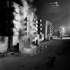Steam rises from a series of furnaces used to make electrodes  1966.