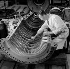 An engineer tests the blades of a gas turbine  English Electric  Whetstone.