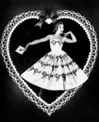 Woman framed by a heart  1950s.