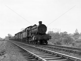 Hall class locomotive with a freight train  c 1935.