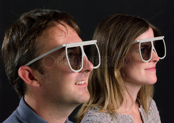 Man and woman wearing Imax 3D glasses  2003.