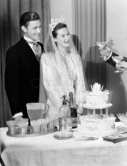 Toasting the bride and groom with champagne  c 1949.