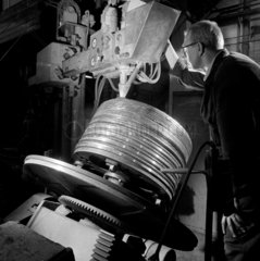 An engineer works on marine engine piston rings at Lockwood and Carlisle.