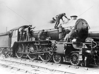 Locomotive being cleaned  c 1935