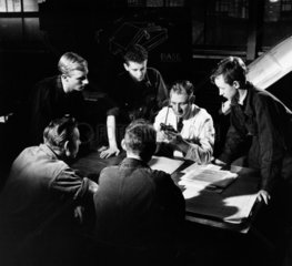 A group of young apprentices at Mullard with master: the shaping tool  1955.