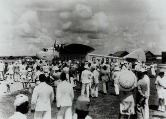 Large crowd waiting to greet G-ABTL 'Astraea' arriving in the Far East   c 1932.