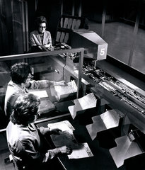 Female operators feed football coupons in to computer sorting machine  1970.
