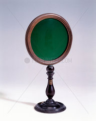 Green glass disc  1725-1750.