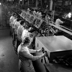 A group of women assemble television equipment at Plessey  1958.