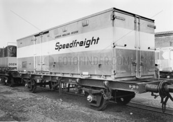 London Midland region Speedfreight container on flat wagon  c 1980s.