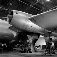 An apprentice trains on undercarriage of Canberra 8 aircraft   Preston  1956.