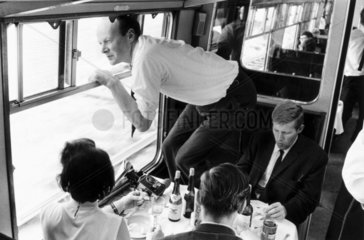 Man leaning out of a train window  11 August 1968.