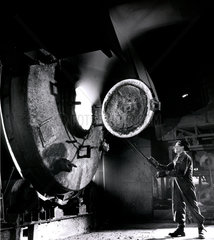 Foundryman opens lead furnace door at Enfield foundry  Platts foundry  1960.