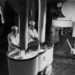 Workers mix floor at the buscuit making plant of William Macdonald  1961.