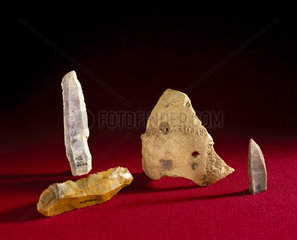 Three flint knives & part of a trepanned skull  France  10000-500 BC.