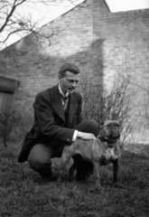 Edwardian man stroking a dog  c 1900s.
