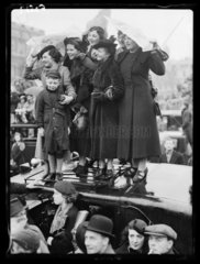 Sheltering from the rain  coronation of King George VI  London  1937.