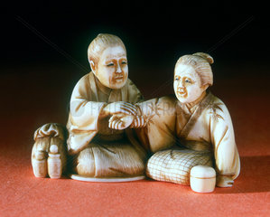 Netsuke of doctor and patient  Japanese  late 19th century.