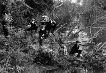 Eton schoolboys on a wooded riverbank in Berkshire  1968.