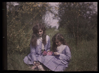 Two girls in a field  1908.