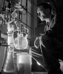 Atmospheric light shot of chemist with hydro grid installation in ICI laboratory.