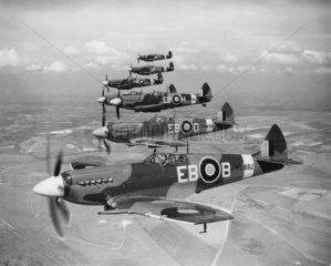 Spitfires in flight  c 1940s.