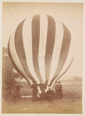 A balloon being inflated  1885-1890.