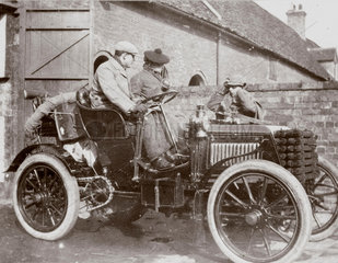 C S Rolls behind the wheel of his 24 hp Panhard  with a passenger  1902.