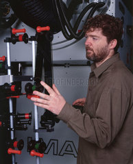 Technician lacing up a film onto an Imax projector  Science Museum  2000.
