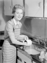 Woman doing the washing up  1950.